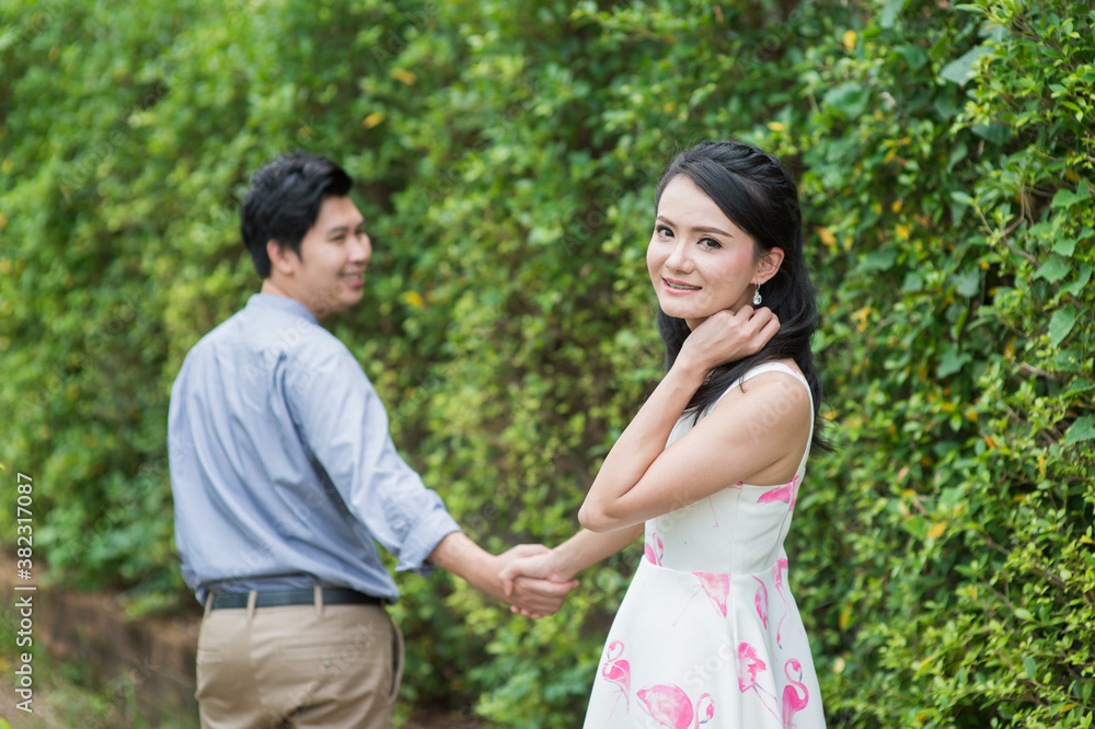 Asian man and woman couples Smiling and happy hugging. Asian man and woman couples Smiling and happy hugging.