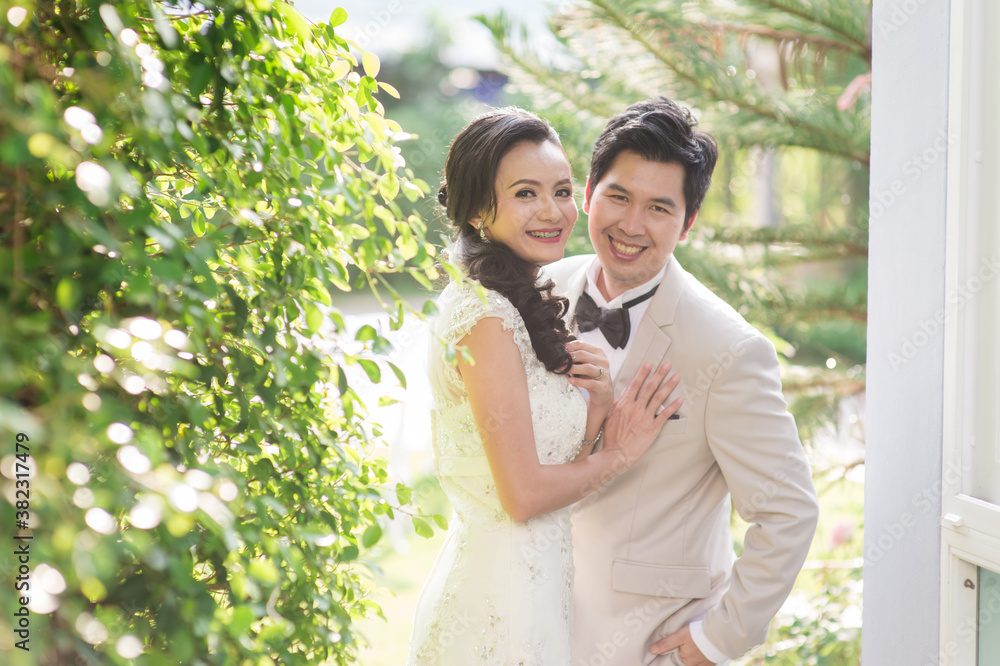 Asian man and woman couples Smiling and happy hugging. Asian man and woman couples Smiling and happy hugging.