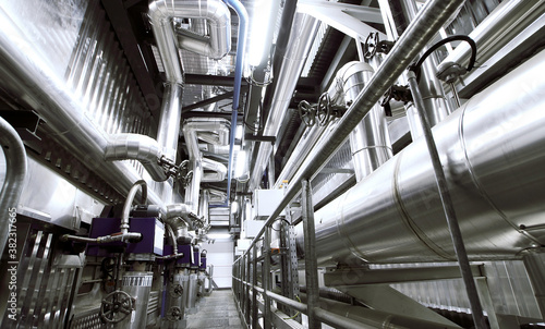 Equipment, cables and piping as found inside of a modern industrial power plant