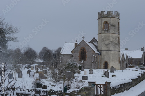 The church and churchyard at Barton St David in the snow. photo