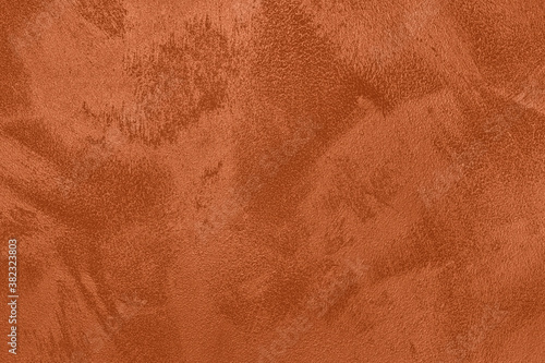 Fototapeta Naklejka Na Ścianę i Meble -  Saturated dark orange brown colored low contrast Concrete textured background with roughness and irregularities. 2021, 2022 color trend.