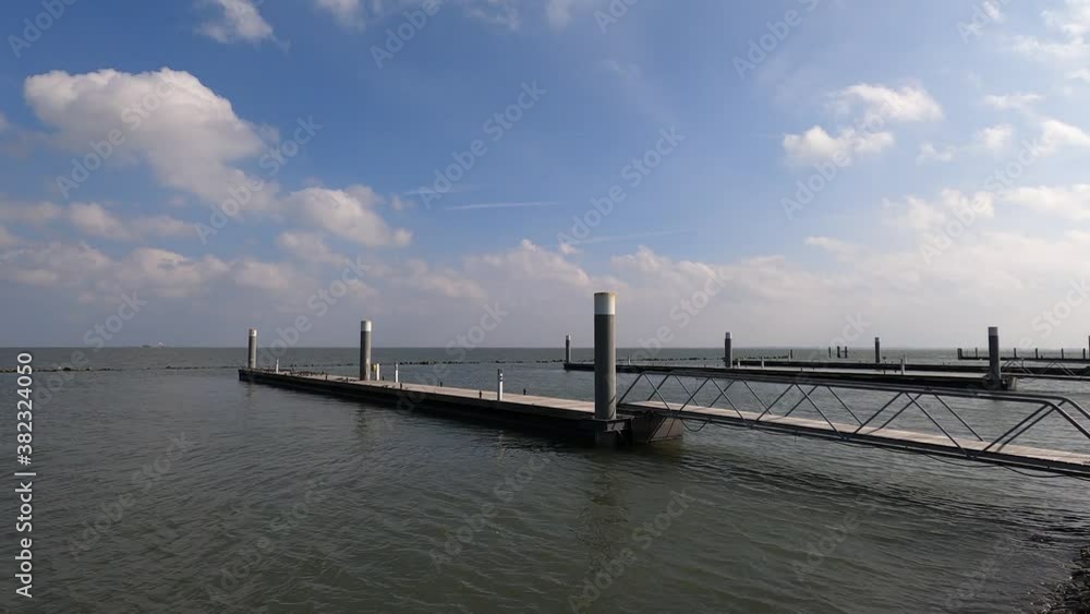 Empty marina of Schiermonnikoog in the Netherlands during high tide Empty marina of Schiermonnikoog in the Netherlands during high tide