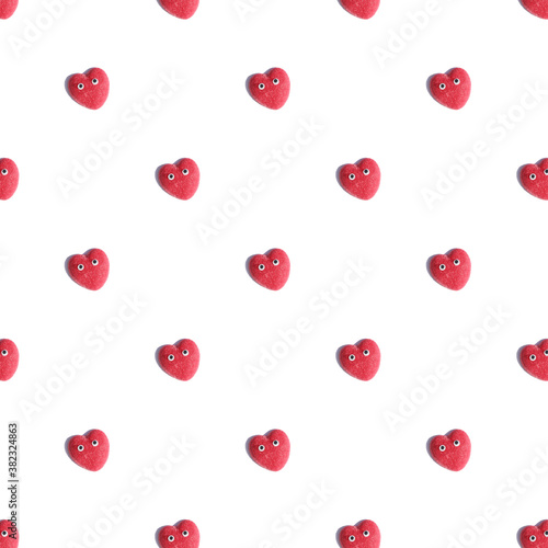 pattern made with red heart with eyes on white background