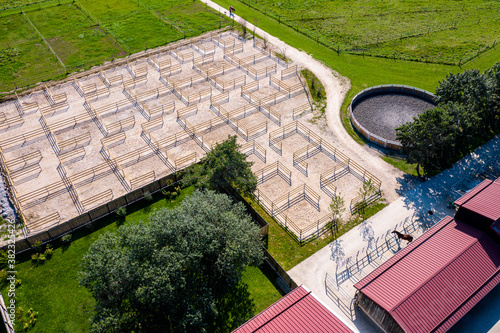 Bild auf Leinwand Outdoor boxes paddocks for horses on a farm