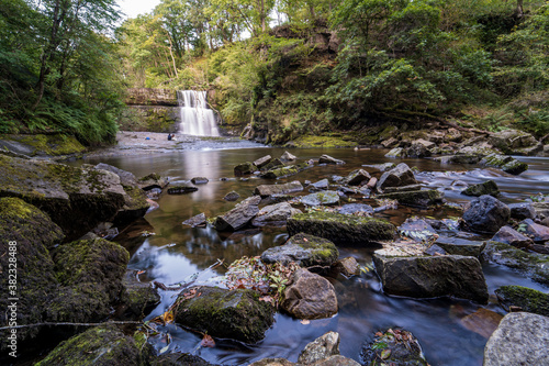 Sgwd Clun-Gwyn Waterfall in Waterfall Country in Brecon Beacons National Park and Fforest Fawr Geopark, the Vale of Neath. South Wales, the United Kingdom photo