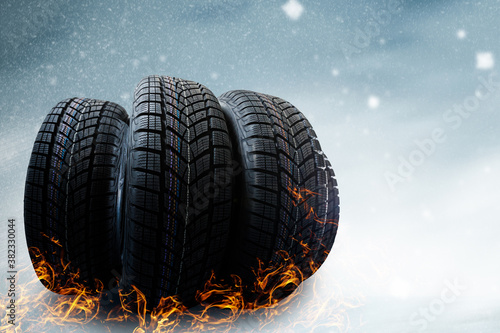 winter tyre cover on Lights on blue and snow background