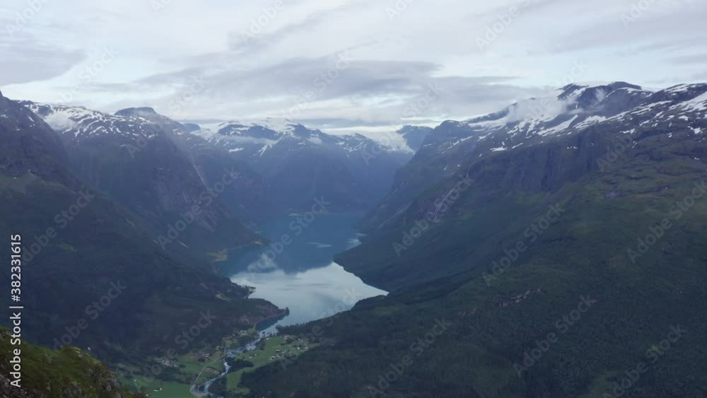 Lovatnet aerial drone view from high above. Hiking child celebrating and overlooking scenery on summer evening Lovatnet aerial drone view from high above. Hiking child celebrating and overlooking scenery on summer evening