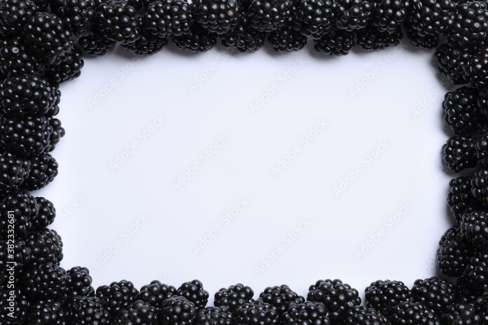 Frame of ripe blackberries on white background, flat lay. Space for text Frame of ripe blackberries on white background, flat lay. Space for text