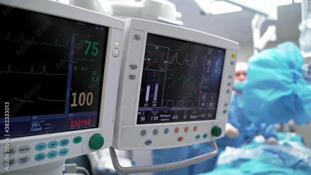 Patient's condition on the health monitor. Medical computers in the intensive care unit show normal vital signs. Critical care concept. Patient's condition on the health monitor. Medical computers in the intensive care unit show normal vital signs. Critical care concept.