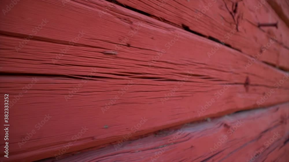 Red house facade of old swedish house close up structure texture pattern cracks view slow motion shot Sweden style.
