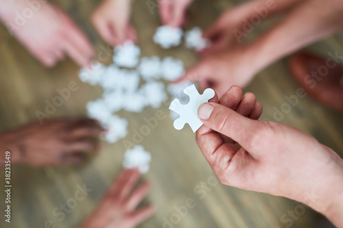 Puzzle piece in the hand of a businessman
