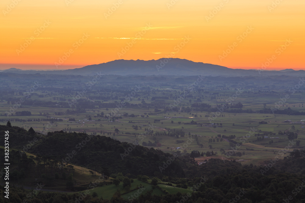 A view over the Waikato Region, New Zealand, at sunset, taken from the Kaimai Mountains. On the horizon is Maungatautari, or Sanctuary Mountain