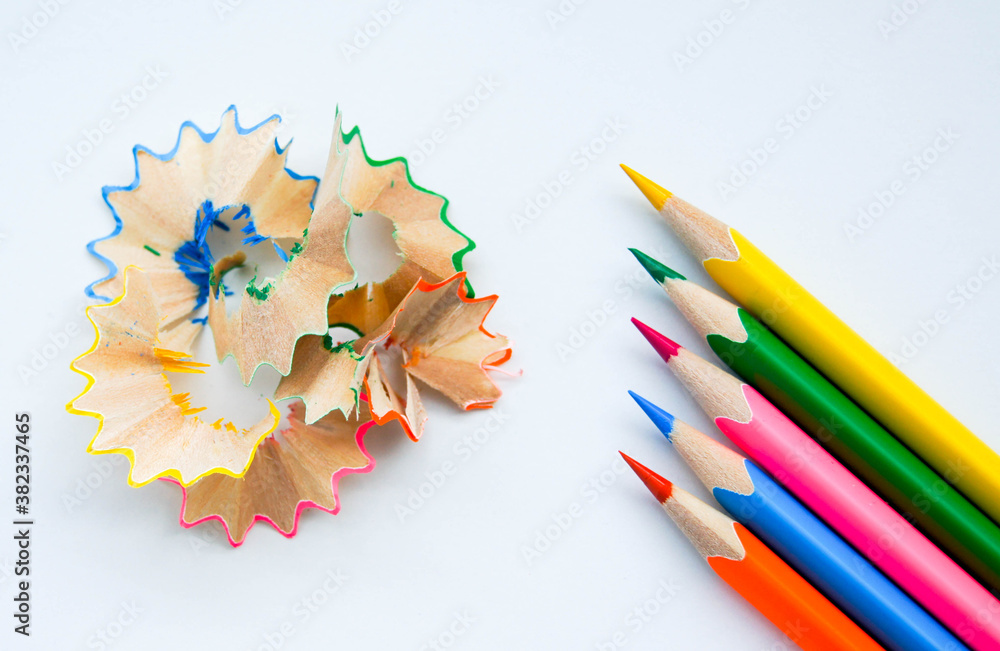 Multicolored set of wooden sharpened pencils on white background