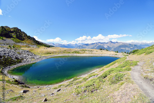 Lake Chamolé, a small alpine lake above Pila in the Aosta valley © balenabianca