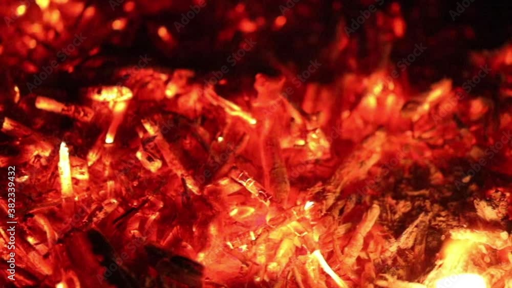 Bright coals shimmer with red and yellow light Bright coals shimmer with red and yellow light