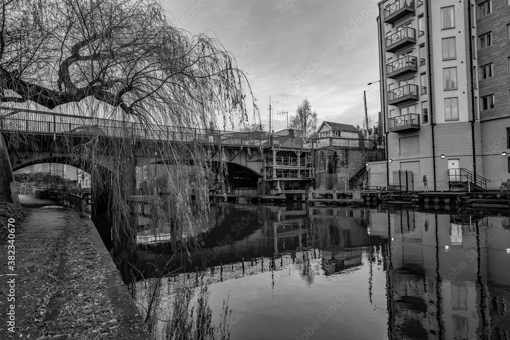 Carrow Road Bridge crossing over the River Wensum in the city of Norwich captured at dusk