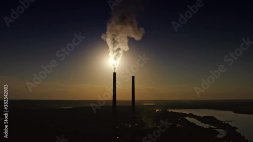 Wallpaper Mural Dense smoke goes from industrial pipe in darkness. Toxic fumes filling the air at night. Dirty emissions from factory into nature. Aerial view. Torontodigital.ca