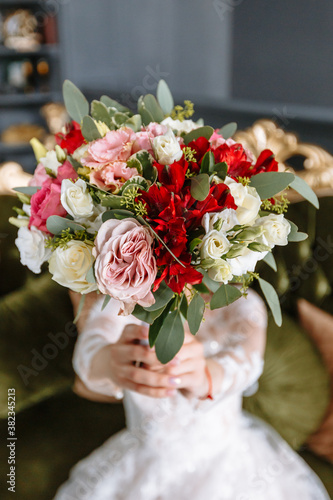 beautiful wedding bouquet in the hands of the bride. The bride holds a bouquet