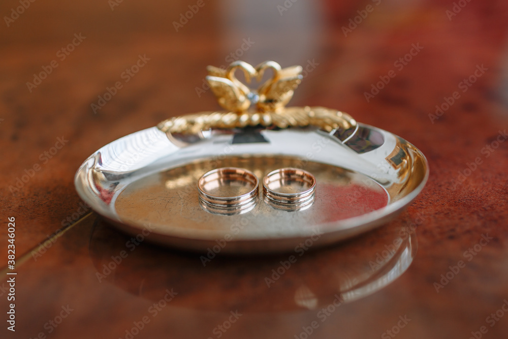 Gold wedding rings lying in a special stand Gold wedding rings lying in a special stand