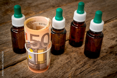 Medicine bottles and money roll