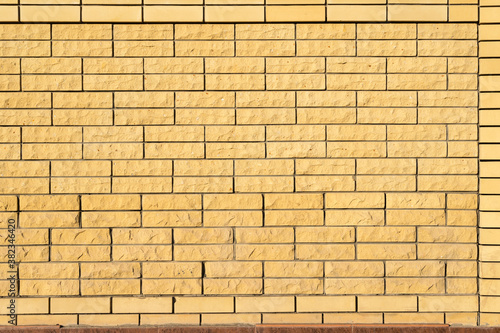 Yellow background wall of decorative bricks.