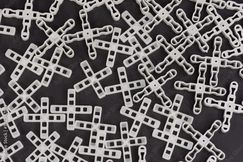 Close up of cross spacers for laying tiles