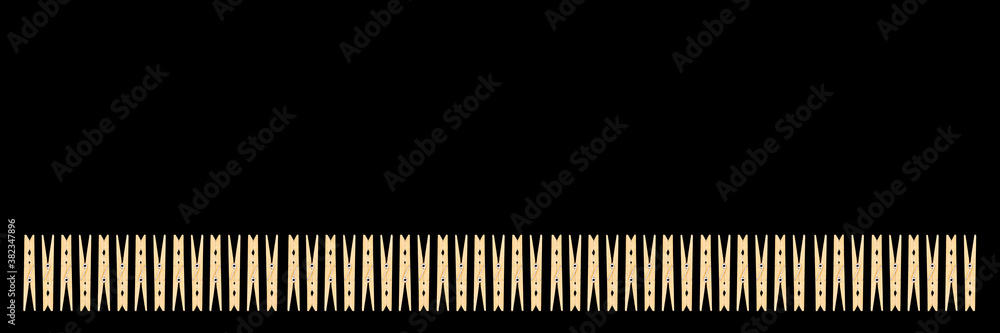White housewife clothespins isolated on black background