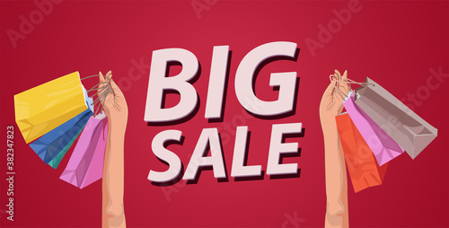 Woman holding up her shopping bags close-up