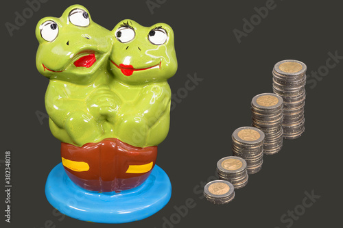 Piggy bank with stacks of coins. Savings concept