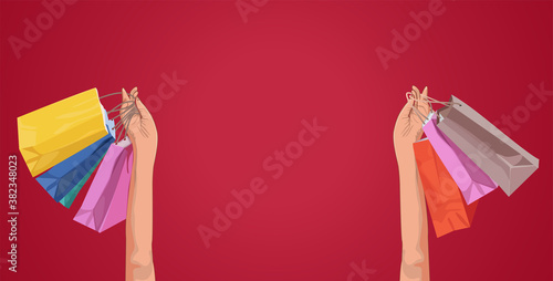 Woman holding up her shopping bags close-up