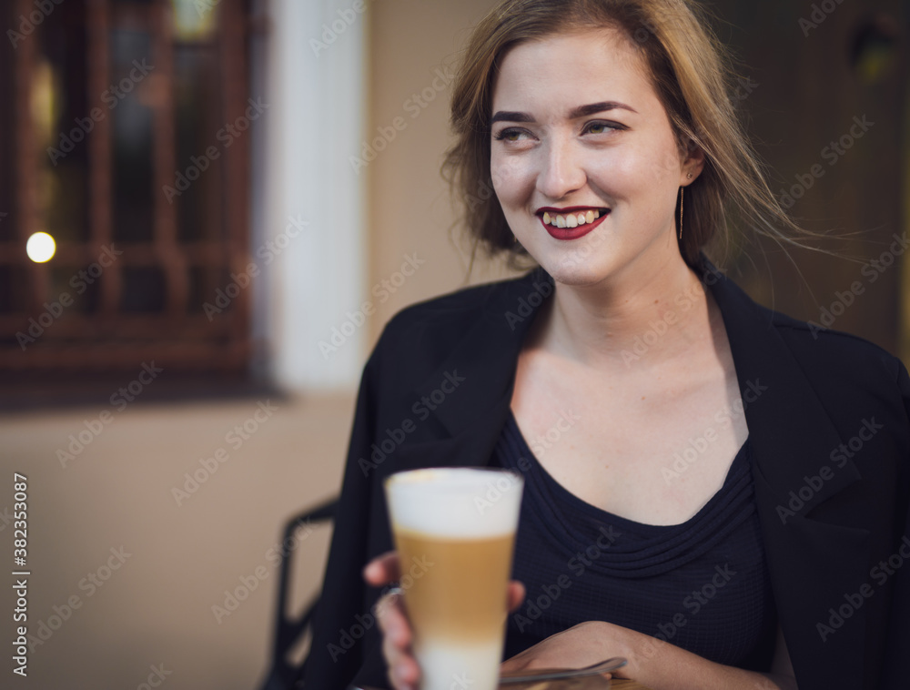 Happy woman smiling and drink coffee in the cafe Happy woman smiling and drink coffee in the cafe