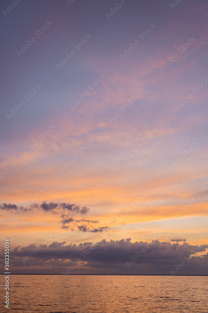 Landscape of sea and cloudy sky at sunset