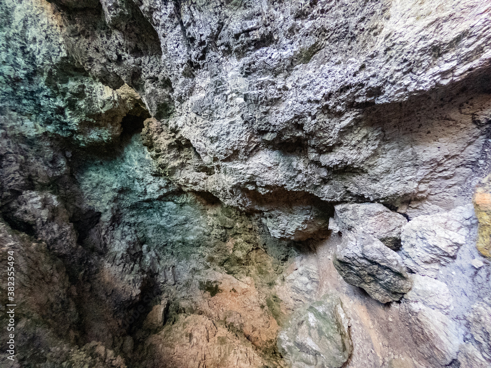 Sea coast calcium calcite cave interior inside top ceiling 