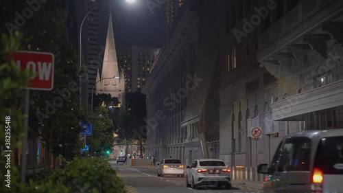 Night Singapore view with road traffic and St. Andrew Cathedral photo