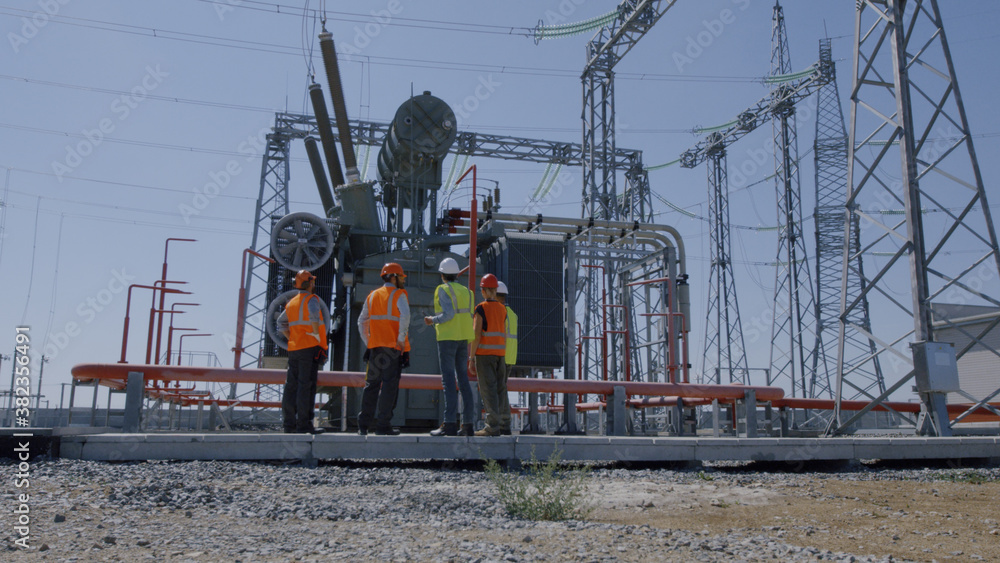 Engineers inspecting modern power plant
