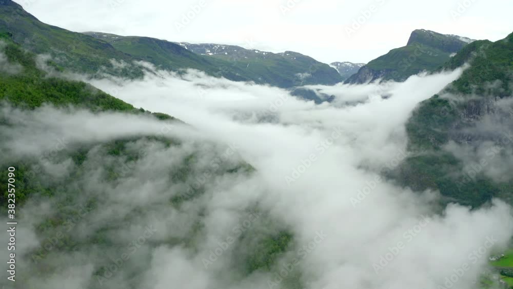 Drone flight above coulds - Norway fjords filled with clouds. Peaceful and calm flight in dull day in Aurlandsfjord. Drone flight above coulds - Norway fjords filled with clouds. Peaceful and calm flight in dull day in Aurlandsfjord.