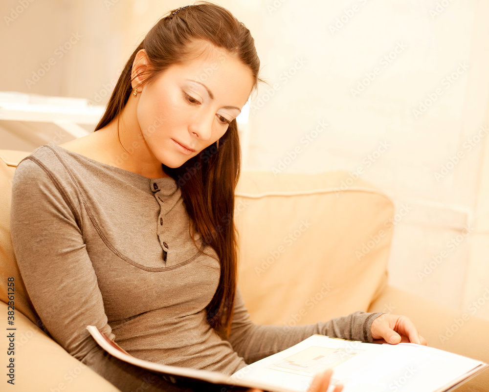 woman reads a magazine woman reads a magazine