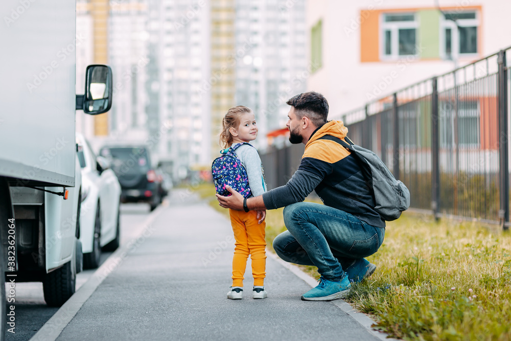 Father and daughter going to school for the first time. Back to school after pandemic. Father and daughter going to school for the first time. Back to school after pandemic.