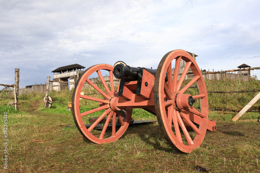 Old cannon on wooden wheels