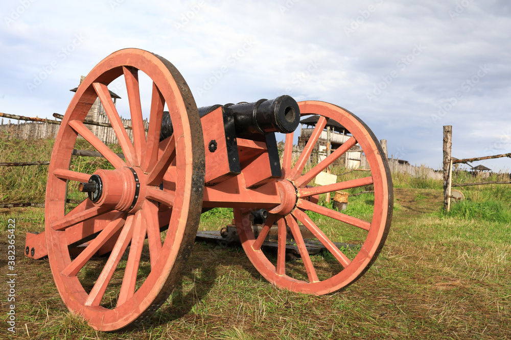 View of old cannon on wooden wheels