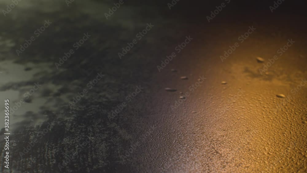Close up light reflected in a wet frosted glass. Background, texture. Close up light reflected in a wet frosted glass. Background, texture.