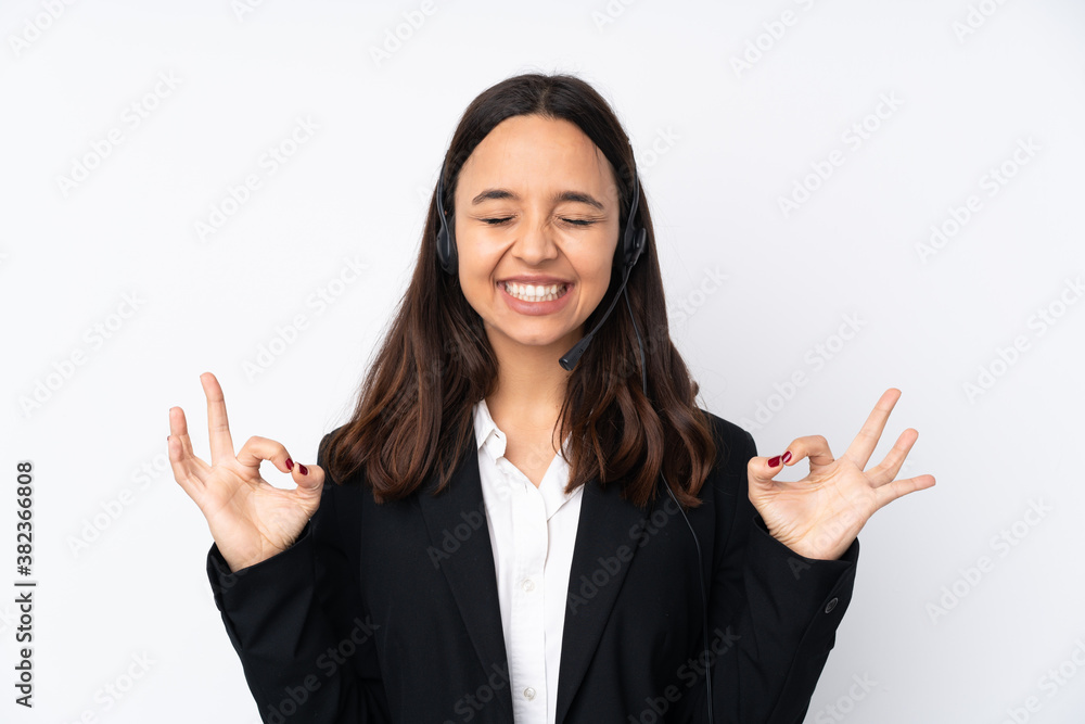 Young telemarketer woman isolated on white background in zen pose Young telemarketer woman isolated on white background in zen pose