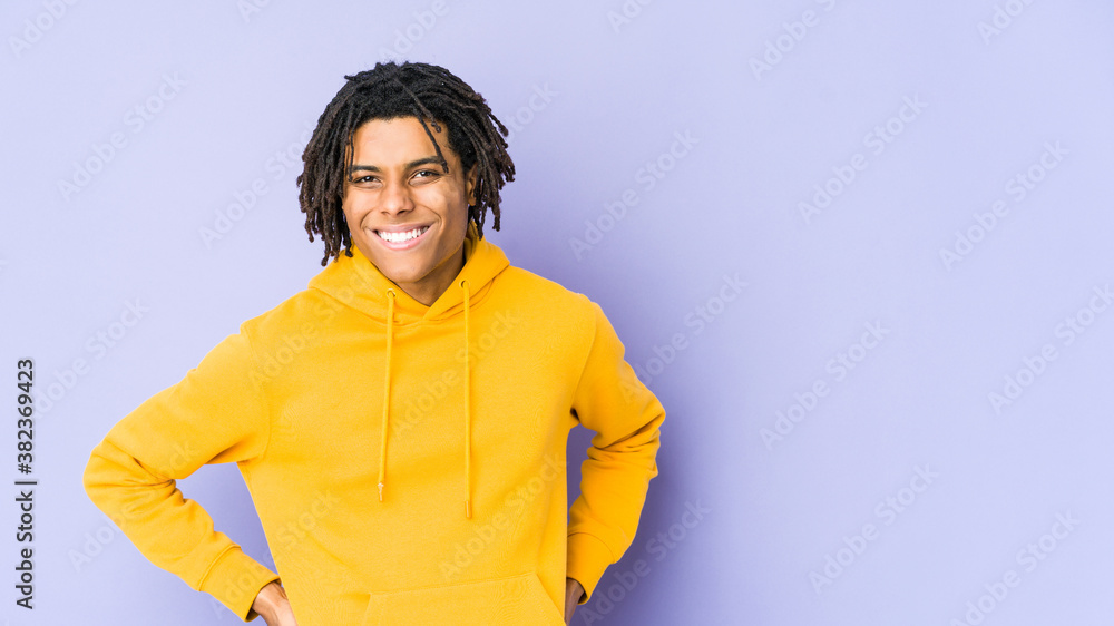 Young african american rasta man happy, smiling and cheerful. Young african american rasta man happy, smiling and cheerful.