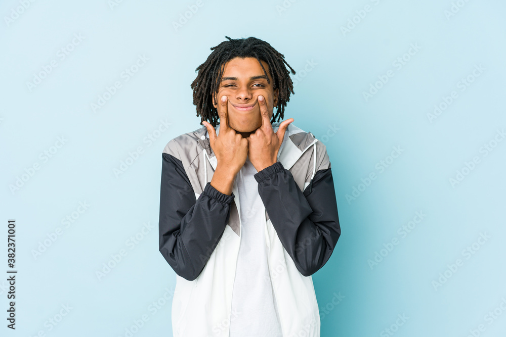 Young african american sport man doubting between two options. Young african american sport man doubting between two options.