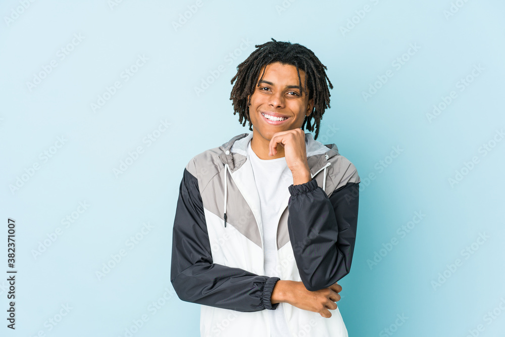Young african american sport man smiling happy and confident, touching chin with hand. Young african american sport man smiling happy and confident, touching chin with hand.