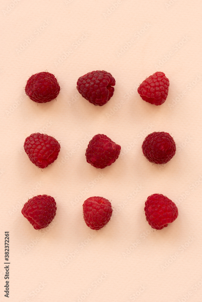 Fresh raspberries on pink background. Top view. Flat lay Fresh raspberries on pink background. Top view. Flat lay