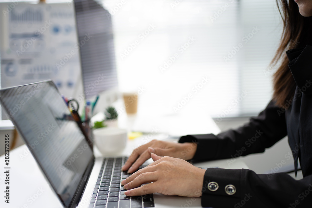 Close up of hand of employees are working in the office. She is using a computer. Close up of hand of employees are working in the office. She is using a computer.