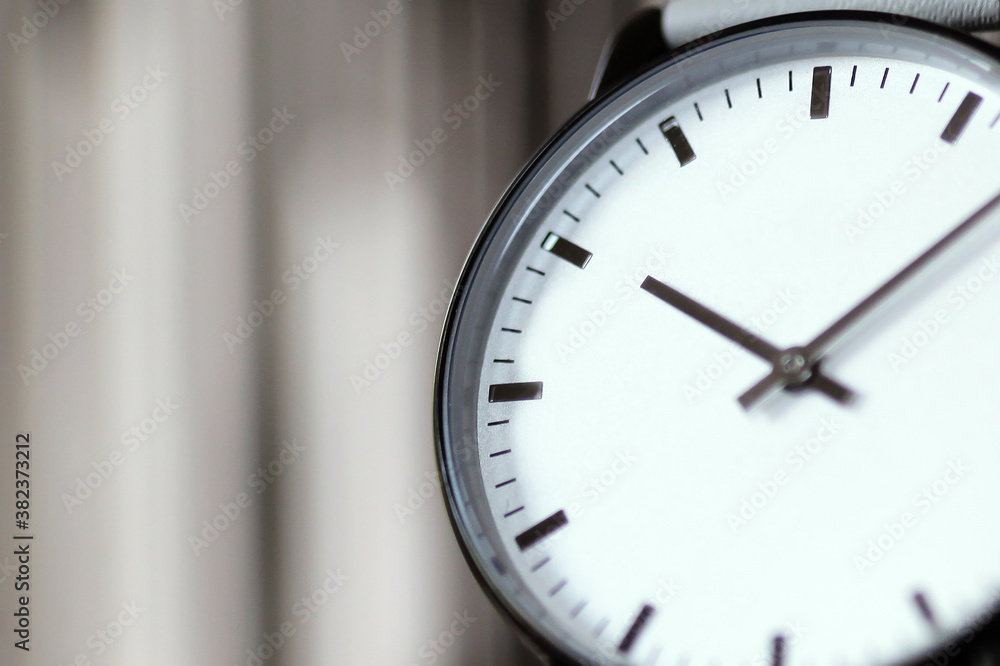 White wristwatch, close up detail. Blurred background White wristwatch, close up detail. Blurred background