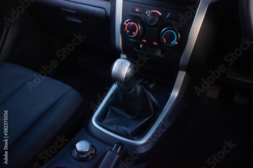 automatic transmission shift selector in the car interior. Closeup a manual shift of modern car gear sifter. © Muanpare
