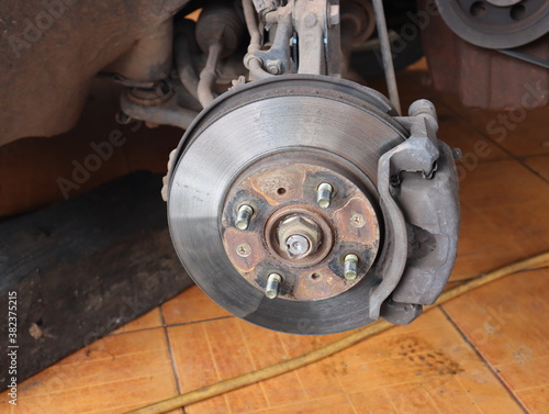 Rusty car front disk brake to be fixed and maintenance  to change the new brake pad